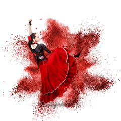 Obraz premium young woman dancing flamenco against explosion