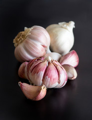 Fresh garlic on a black table