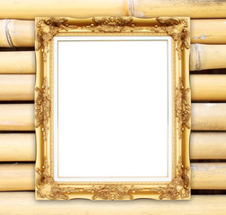 blank golden frame on colorful bamboo wall