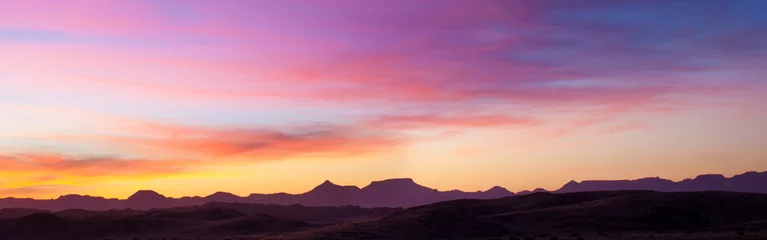 Selbstklebende Fototapeten Rosa Sonnenuntergang über der Wüste © Gianfranco Bella