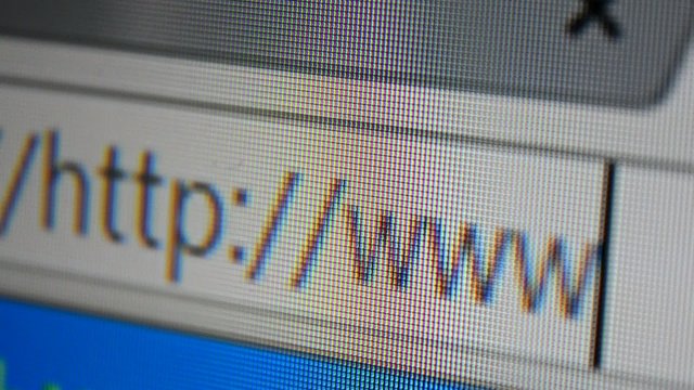 Close up of mouse cursor typing in web browser address bar