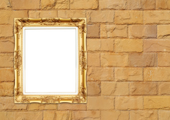 Fototapeta na wymiar blank golden frame on brick stone wall