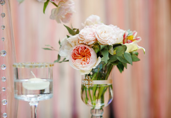 Flowers bouquet and candle as decoration