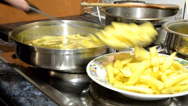 French Fries boiling in oil.