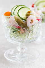 Shrimps salad in crystal bowl