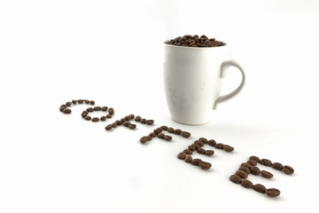 Roasted coffee beans in a cup with name