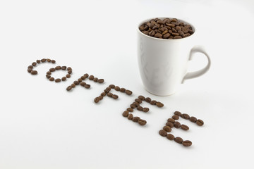 Roasted coffee beans in a cup with name