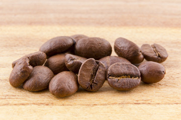 roasted coffee beans on rustic wood