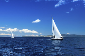 Fototapeta na wymiar Sailing on luxury yachts in the waters of the Aegean Sea.