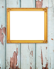 blank golden frame on wood wall