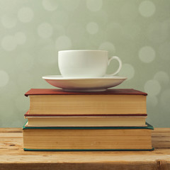 Coffee cup on old books