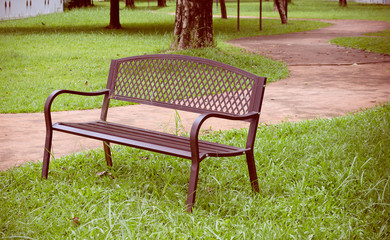 wooden park bench at the public park image