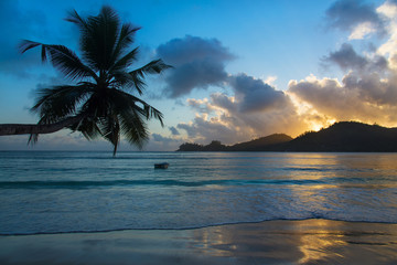 Beach Baie Lazare with boat at sunset, Mahe, Seychelles