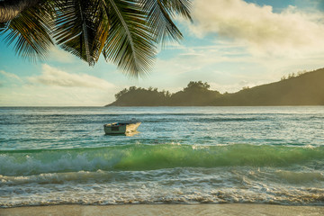 Tropical beach Baie Lazare at sunset, Mahe island, Seychelles