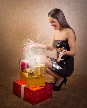 happy teenage girl with magical Christmas present box