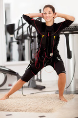 Obraz premium woman, ems electro muscular stimulation exercise
