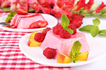 Cakes with fruit and berries on plate on napkin
