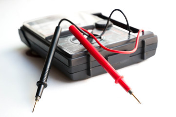 analog multimeter on white background.