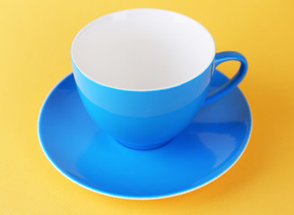 Colorful cup on color background