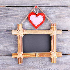 Rectangular chalkboard on wooden background