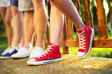 Naklejka premium Sneakers of teenage boys and girls