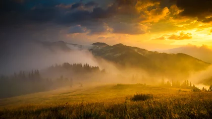 Foto op Plexiglas Amazing mountain landscape with fog and a haystack © seqoya