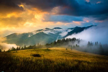 Zelfklevend Fotobehang Amazing mountain landscape with fog and a haystack © seqoya