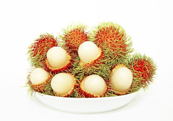 Rambutans on a plate - stock image