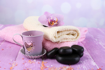 Obraz na płótnie Canvas Orchid flower, spa stones and towels