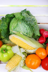 Vegetables on white wooden box background
