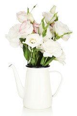 Obraz na płótnie Canvas Beautiful eustoma flowers in teapot, isolated on white