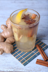 Glass of ginger drink with lemon