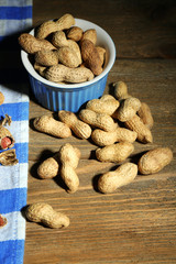 Peanuts on wooden background