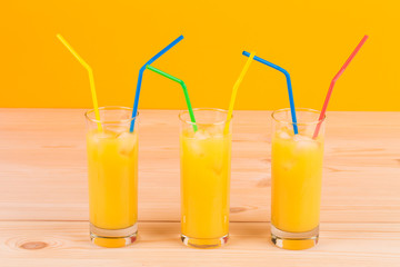 Glasses full of orange juice.