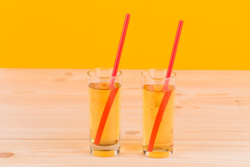 Apple juice on wooden table.