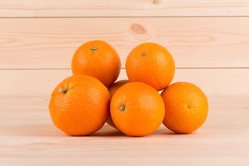 Fresh oranges on wood table.