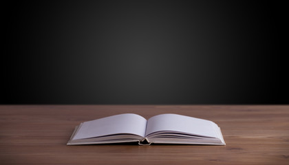 Open book on wooden deck