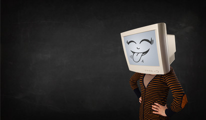Young girl wearing a monitor with a funny face