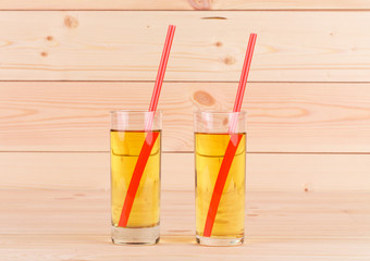 Apple juice on wood table.