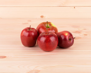 Ripe apples on wood table.