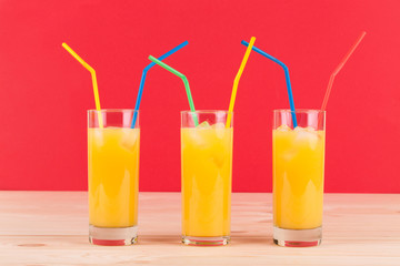 Orange juice on wooden table.