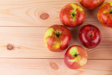 Ripe apples on wood table.