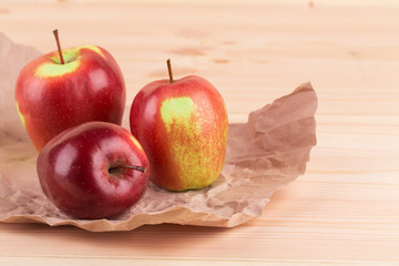 Ripe apples on wood table.