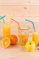 Fruits and juice on wood table.