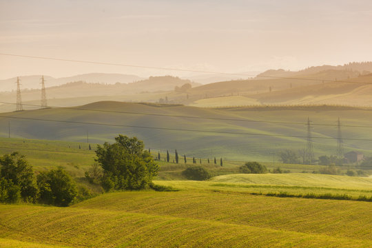 Morning landscape with the high voltage line, Tuscany, Italy