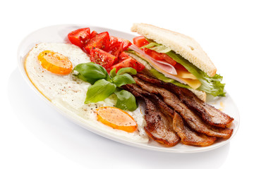 Breakfast - toast, egg, bacon and vegetables
