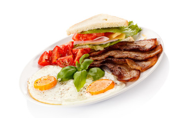 Breakfast - toast, egg, bacon and vegetables