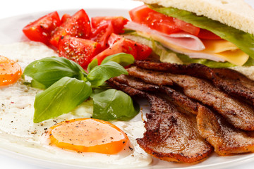 Breakfast - toast, egg, bacon and vegetables