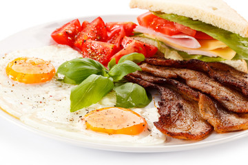 Breakfast - toast, egg, bacon and vegetables