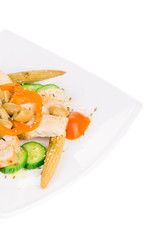 Warm meat salad with vegetables.